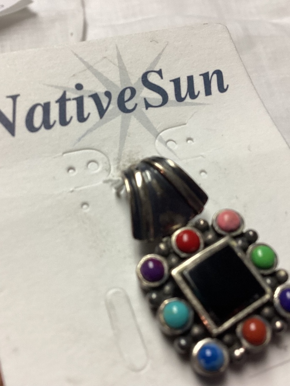 Native sun pendant assorted stones turquoise too.